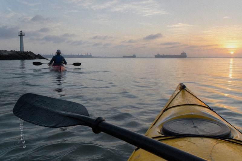 Sea kayakers paddling the Galveston harbor